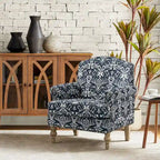 Fauteuil de ferme clouté avec accoudoirs roulés